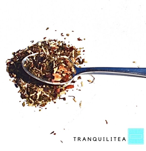 A spoon with tea on it and the words " tranquilitea ".