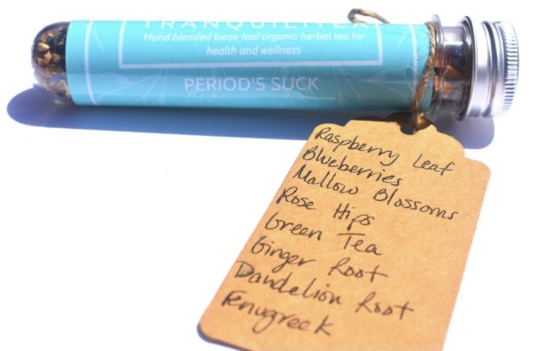 A blue tube of tea and some handwritten notes
