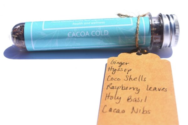 A blue tube of cocoa is next to a tag.
