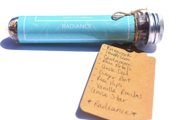 A blue tube with some handwritten notes on it