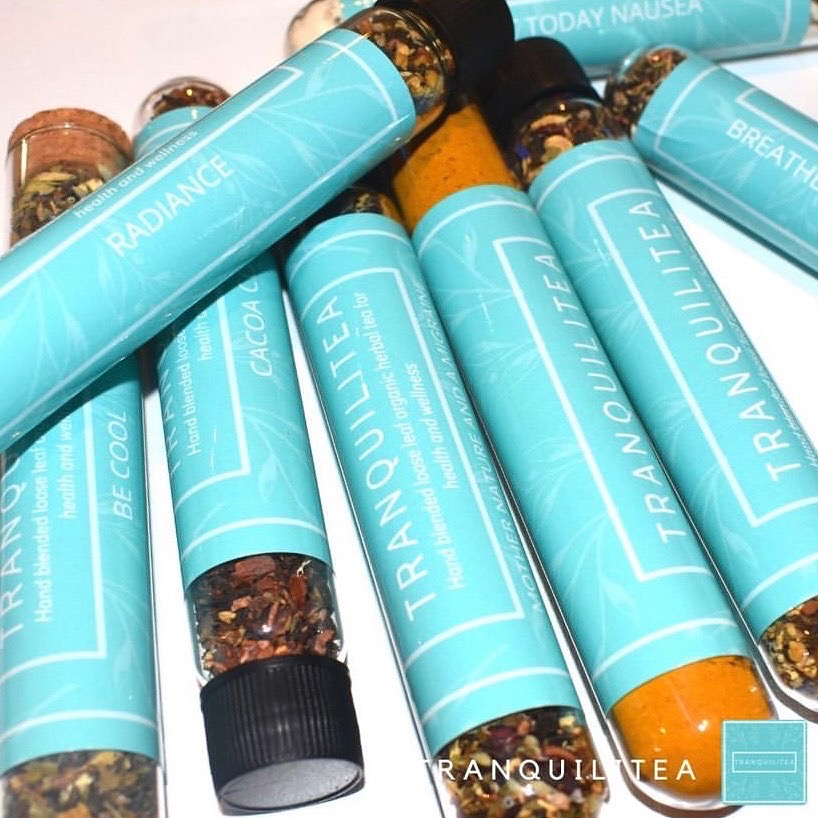 A group of blue tubes with different flavors of tobacco.